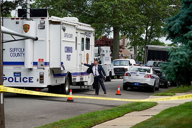 Authorities search Heuermann's home on July 18, in Massapequa Park, New York.
Mandatory Credit:	John Minchillo/AP