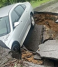 This road in Graves County, Kentucky, was washed out by flooding on July 19, the sheriff's office said.
Mandatory Credit:	Graves County Sheriff's Office