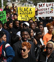 Demonstrators protest Florida Gov. Ron DeSantis' plan to eliminate Advanced Placement courses on African American studies in high schools as they stand outside the Florida State Capitol in Tallahassee on February 15.
Mandatory Credit:	Joshua Lott/The Washington Post/Getty Images