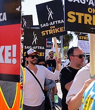 SAG-AFTRA actors strike against the Hollywood studios as they join the Writers Guild of America (WGA) on the picket like outside of Netflix offices in Los Angeles, on July 14.
Mandatory Credit:	Mike Blake/Reuters
