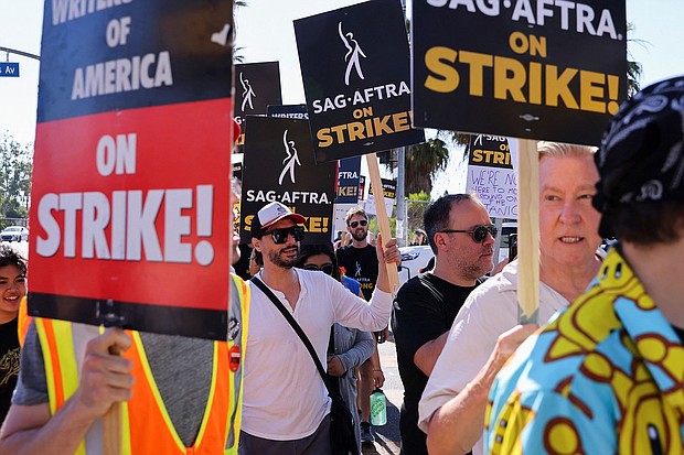 SAG-AFTRA actors strike against the Hollywood studios as they join the Writers Guild of America (WGA) on the picket like outside of Netflix offices in Los Angeles, on July 14.
Mandatory Credit:	Mike Blake/Reuters