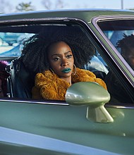 Jamie Foxx, Teyonah Parris and John Boyega in "They Cloned Tyrone."
Mandatory Credit:	Parrish Lewis/Netflix