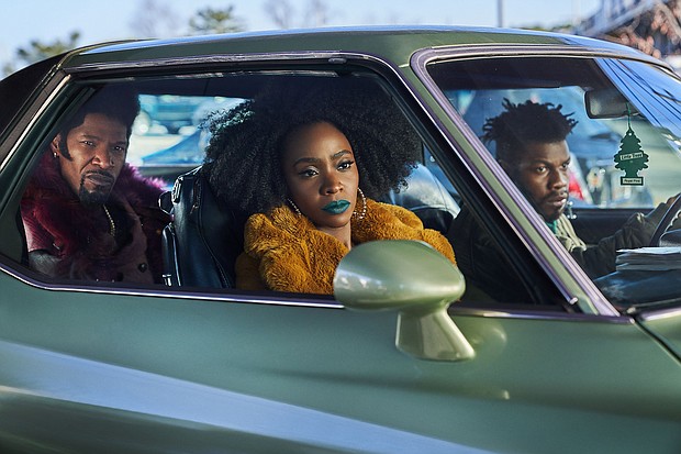 Jamie Foxx, Teyonah Parris and John Boyega in "They Cloned Tyrone."
Mandatory Credit:	Parrish Lewis/Netflix