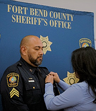 Sergeant Hernandez was pinned by his wife Sandra Hernandez.