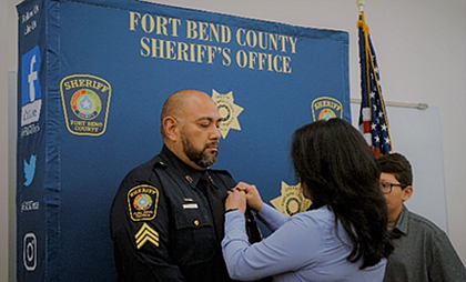 Sergeant Hernandez was pinned by his wife Sandra Hernandez.