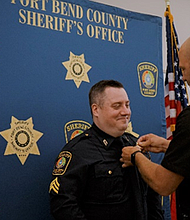 Sgt. Phillips being pinned by Sergeant Casey Schmidt.