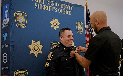 Sgt. Phillips being pinned by Sergeant Casey Schmidt.