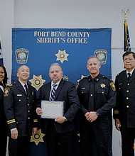Investigator Eli Cisneros and Investigators Thomas Cantu and Karlnetta Coleman