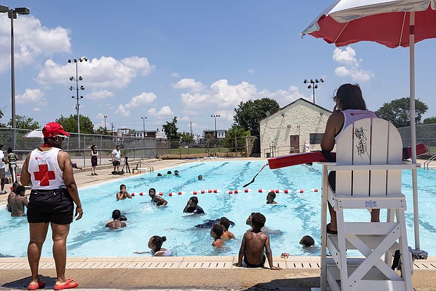 Many cities have struggled to hire lifeguards, leading to pool closures.
Mandatory Credit:	Hannah Beier/Reuters