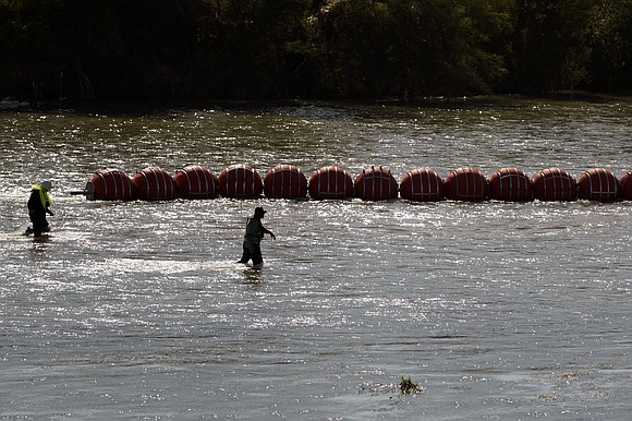 The US Department of Justice is suing the state of Texas over its use of floating barriers in the Rio …