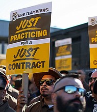 UPS and the Teamsters have reached a tentative deal on a new contract. UPS teamsters here hold a rally outside a UPS facility in Los Angeles, on July 19.
Mandatory Credit:	Mike Blake/Reuters