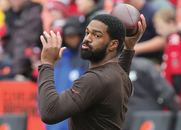 Washington Commanders quarterback Jacoby Brissett signs fan