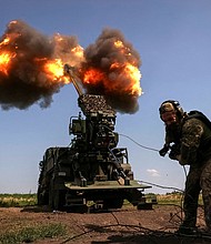 A Ukrainian serviceman of the 57th Kost Hordiienko Separate Motorised Infantry Brigade fires a 2S22 Bohdana self-propelled howitzer towards Russian troops, amid Russia's attack on Ukraine, at a position near the city of Bakhmut in Donetsk region, Ukraine July 5.
Mandatory Credit:	Sofiia Gatilova/Reuters