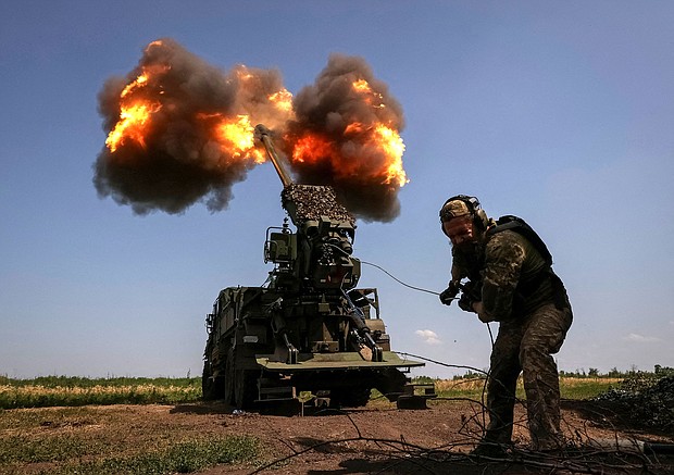 A Ukrainian serviceman of the 57th Kost Hordiienko Separate Motorised Infantry Brigade fires a 2S22 Bohdana self-propelled howitzer towards Russian troops, amid Russia's attack on Ukraine, at a position near the city of Bakhmut in Donetsk region, Ukraine July 5.
Mandatory Credit:	Sofiia Gatilova/Reuters