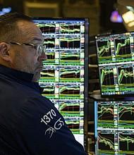 Traders work the floor of the New York Stock Exchange on July 25, in New York City.
Mandatory Credit:	Angela Weiss/AFP/Getty Images
