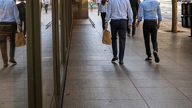 Pictured are pedestrians on California Street in the financial district of San Francisco, in 2022.
Mandatory Credit:	David Paul Morris/Bloomberg/Getty Images