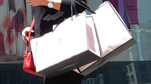 The pace of price increases slowed last month. A pedestrian carries shopping bags while walking through Union Square in San Francisco.
Mandatory Credit:	Justin Sullivan/Getty Images/FILE