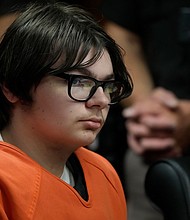 Ethan Crumbley sits in court, Thursday, July 27, in Pontiac, Michigan.
Mandatory Credit:	Carlos Osorio/AP