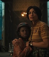 Chase W. Dillon and Rosario Dawson star in Disney's "Haunted Mansion."
Mandatory Credit:	Walt Disney Studios