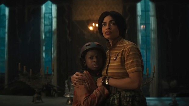 Chase W. Dillon and Rosario Dawson star in Disney's "Haunted Mansion."
Mandatory Credit:	Walt Disney Studios