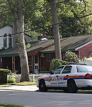 Nassau County police car is parked outside the home of alleged killer of three sex workers in the Gilgo Beach case, Rex Heuermann, on July 26.
Mandatory Credit:	James Carbone/Newsday RM/Getty Images