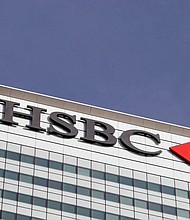The HSBC bank logo is seen in the Canary Wharf financial district in London, in 2016.
Mandatory Credit:	Reinhard Krause/Reuters/FILE