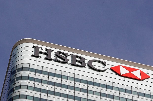 The HSBC bank logo is seen in the Canary Wharf financial district in London, in 2016.
Mandatory Credit:	Reinhard Krause/Reuters/FILE