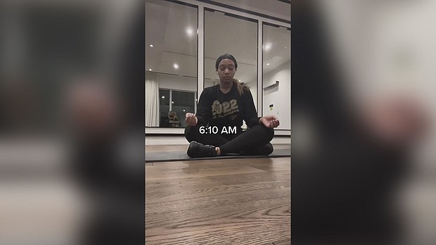 A screenshot from one of Veronique Davidson's "5 to 9 before the 9 to 5" TikToks shows her meditating early in the morning.
Mandatory Credit:	Courtesy Vero Simonee