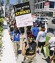 Actors in the SAG-AFTRA union join the already striking WGA union, film and tv writers on the picket line, on Day 3 of a SAG-AFTRA strike, in Los Angeles, California, on July 14.
Mandatory Credit:	Katie McTiernan/Anadolu Agency via Getty Images