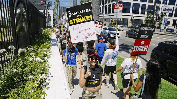 Actors in the SAG-AFTRA union join the already striking WGA union, film and tv writers on the picket line, on Day 3 of a SAG-AFTRA strike, in Los Angeles, California, on July 14.
Mandatory Credit:	Katie McTiernan/Anadolu Agency via Getty Images