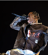 Travis Scott performs at his third annual Astroworld Festival in Houston on Nov. 5, 2021. Ten fans died during a crowd surge at the concert. Credit: Jennifer Lake/Sipa USA via REUTERS