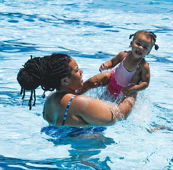 Sharde Robinson and her 1-year-old daughter, Alora Rasor, beat the heat in the Blackwell Pool last Saturday. The pool is open to the public throughout the summer from noon to 5 p.m. Saturday, 1 to 5 p.m. Sunday and holidays, and 1 to 4:30 p.m. Monday through Friday for open swimming, 5 to 7 p.m. for family swims and 7 to 8 p.m. for adult swim.