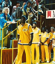 Magic Johnson (Quincy Isaiah) leads the Lakers onto the court in Season 2 of "Winning Time: The Rise of the Lakers Dynasty."
Mandatory Credit:	HBO