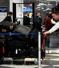 The bag was at Chicago, in exactly the place the AirTag had said it was.
Mandatory Credit:	Nam Y. Huh/AP