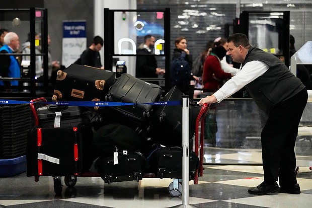 The bag was at Chicago, in exactly the place the AirTag had said it was.
Mandatory Credit:	Nam Y. Huh/AP