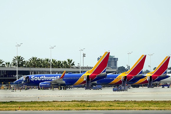 A mother is suing Southwest Airlines for racial discrimination, saying she was accused of human trafficking when traveling with her ...