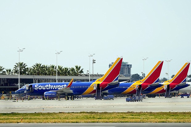 A mother is suing Southwest Airlines for racial discrimination, saying she was accused of human trafficking when traveling with her biracial child.
Mandatory Credit:	Ashley Landis/AP