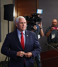 Former Vice President Mike Pence speaks to the press on July 14 in Des Moines, Iowa. Former Vice President Mike Pence said he would comply with the law if he were compelled to testify in former President Donald Trump’s trial in the 2020 election case.
Mandatory Credit:	Scott Olson/Getty Images
