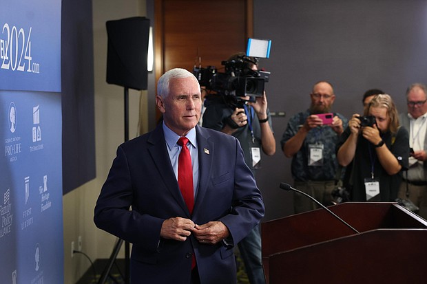 Former Vice President Mike Pence speaks to the press on July 14 in Des Moines, Iowa. Former Vice President Mike Pence said he would comply with the law if he were compelled to testify in former President Donald Trump’s trial in the 2020 election case.
Mandatory Credit:	Scott Olson/Getty Images