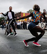 People gather at a memorial for O'Shae Sibley on August 4 in New York City. The memorial was held at the gas station where Sibley was fatally stabbed.
Mandatory Credit:	Spencer Platt/Getty Images