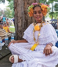 Emely Cabrera, 10, waits to perform with El Groupa La Palma during the 13th St. Elizabeth’s Jazz and Food Festival on Saturday in Highland Park. About 300 people attended this year’s event that helped jumpstart several local performances during Richmond Music Week.