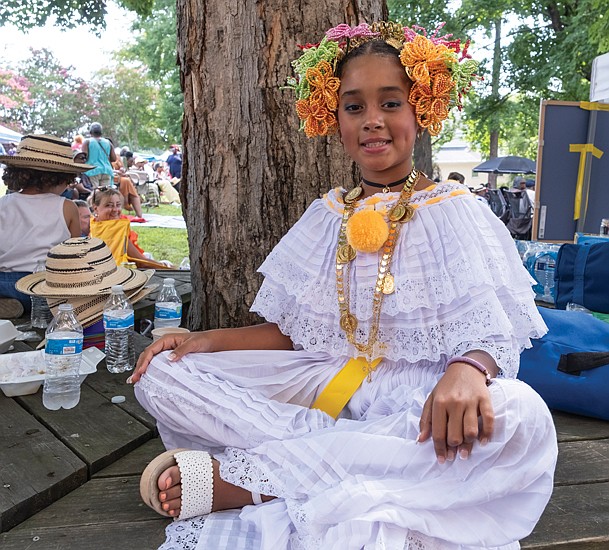 Emely Cabrera, 10, waits to perform with El Groupa La Palma during the 13th St. Elizabeth’s Jazz and Food Festival on Saturday in Highland Park. About 300 people attended this year’s event that helped jumpstart several local performances during Richmond Music Week.