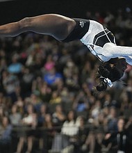 Simone Biles soars in her return to competition on Saturday, Aug. 5, following a two-year layoff. The gymnastics star easily won the U.S. Classic, posting a score of 59.100, a full five points ahead of Leanne Wong.