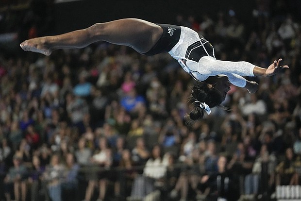 Simone Biles soars in her return to competition on Saturday, Aug. 5, following a two-year layoff. The gymnastics star easily won the U.S. Classic, posting a score of 59.100, a full five points ahead of Leanne Wong.