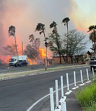 Smoke and flames rise in Lahaina, Maui County, Hawaii, August 8 in this still image from video obtained from social media.
Mandatory Credit:	Jeff Melichar/TMX/Reuters