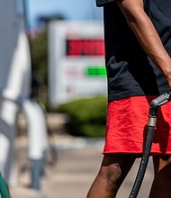 A person pumps gas at a Shell gas station on August 3 in Austin, Texas. Gas stations around the country have boosted prices by an average of 26 cents a gallon over the past month as irregular temperatures have made fuel-making more challenging due to the slowing of cooling processes needed to refine crude oil.
Mandatory Credit:	Brandon Bell/Getty Images