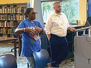 Sheba Williams, founder of Nolef Turns, and Rob Poggenklass, executive director of Justice Forward Virginia, speak at the July 15 expungement workshop.