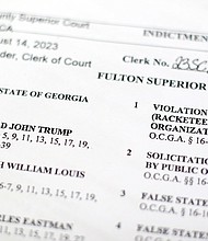 The indictment in Georgia against former President Donald Trump is photographed Monday, Aug. 14, 2023.
Mandatory Credit:	Rebecca Wright/CNN