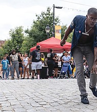 Local R&B, soul and lyrical rap artist Googsz, below, entertains at the celebration in Shockoe Bottom. The event jumpstarted Richmond Music Week.