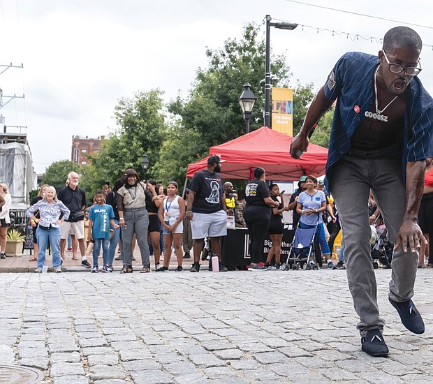 Local R&B, soul and lyrical rap artist Googsz, below, entertains at the celebration in Shockoe Bottom. The event jumpstarted Richmond Music Week.